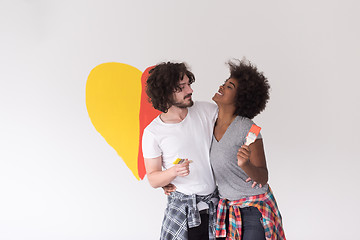 Image showing couple with painted heart on wall