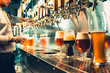 Image showing Glass of beer with barrel, bottle and fresh hops still-life