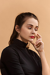 Image showing Young serious thoughtful business woman. Doubt concept.