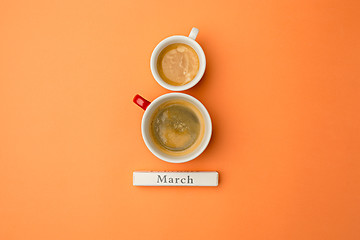 Image showing View from above with two cups of coffee with copy space. Background for woman day, 8 March. Orange table.