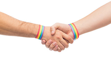 Image showing hands with gay pride wristbands make handshake