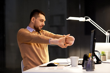 Image showing man with computer working late at night office