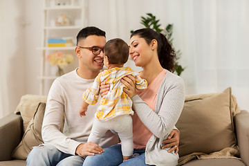 Image showing happy family with baby daughter at home