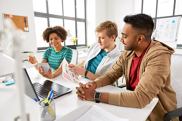 Image showing creative office workers discussing user interface