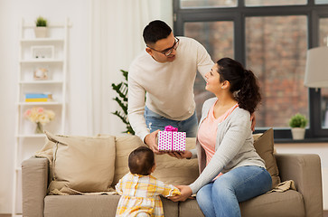 Image showing happy family with birthday present at home