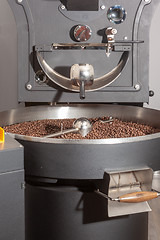 Image showing Roasting machine with finished coffee 