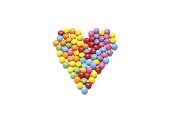 Image showing Abstract heart from colored chocolate candy in multicolored glaz