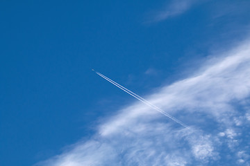 Image showing Plane, contrail and Cirrocumulus Clouds