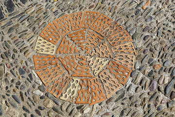 Image showing Patterned floor with sea pebbles and red bricks 