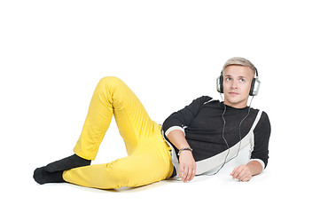 Image showing Man in headphones lying down