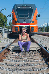 Image showing Young trendy guy in front of train