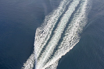 Image showing Trail of a motorboat on the water, aerial view