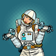 Image showing woman astronaut with dumbbells