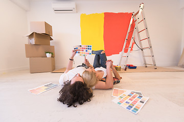 Image showing Happy young couple relaxing after painting