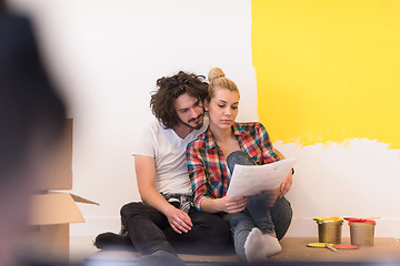 Image showing Happy young couple relaxing after painting