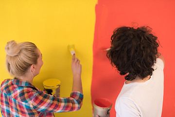 Image showing couple painting interior wall