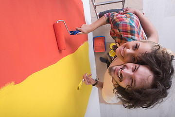 Image showing couple painting interior wall