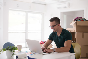 Image showing Young man moving in a new home