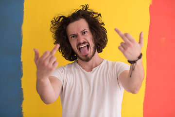 Image showing young man with funny hair over color background