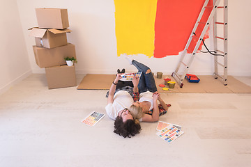 Image showing Happy young couple relaxing after painting