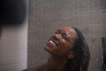 Image showing African American woman in the shower