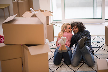 Image showing Young couple moving in a new flat