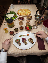 Image showing Man eating in georgian restaurant