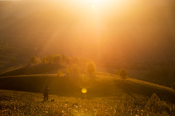 Image showing Silhouette of photographer on sunset.