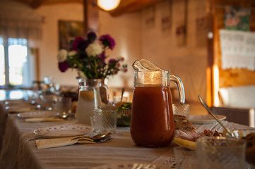 Image showing Decorated table with jug of juice