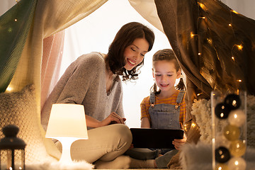 Image showing family with tablet pc in kids tent at home