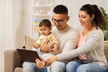 Image showing mother, father and baby with tablet pc at home