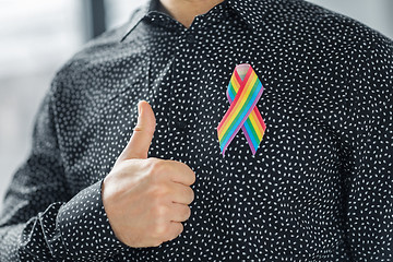 Image showing man with gay pride rainbow awareness ribbon