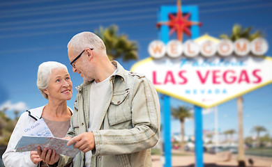 Image showing senior couple with map travelling to las vegas