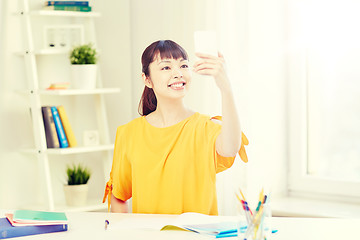 Image showing asian woman student taking selfie with smartphone