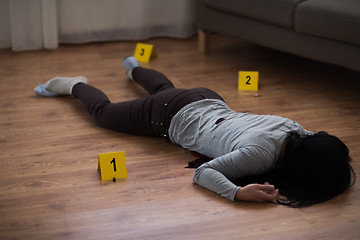 Image showing dead woman body in blood on floor at crime scene