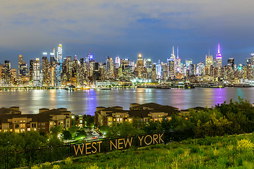 Image showing West New York City midtown Manhattan skyline view from Boulevard East Old Glory Park over Hudson River at dusk.