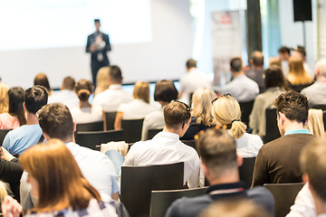 Image showing Business speaker giving a talk at business conference event.