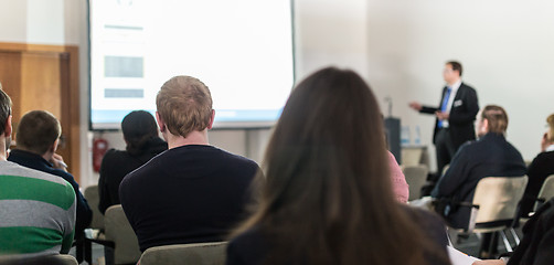 Image showing Business speaker giving a talk at business conference event.