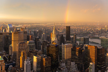 Image showing Skyscrapers at midtown New York City with the East River on the background at dramatic after the storm sunset light.