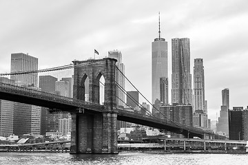 Image showing Brooklyn Bridge and Manhattan skyline in black and white, New York, USA.