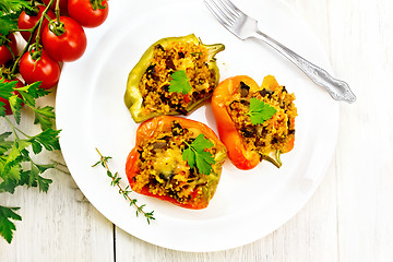 Image showing Pepper with mushrooms and couscous in plate on light board