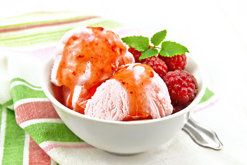 Image showing Ice cream crimson with syrup on towel