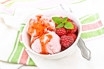 Image showing Ice cream crimson with syrup on board