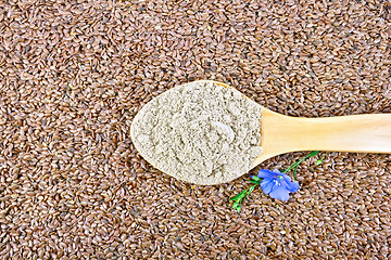 Image showing Flour linen in wooden spoon with flower on seeds