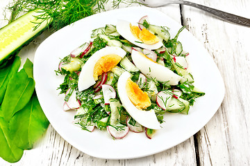 Image showing Salad with radish and egg in plate on table