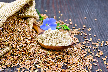 Image showing Flour flax in spoon with flower on board