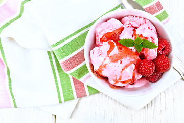 Image showing Ice cream crimson with syrup on towel top