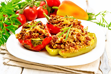 Image showing Pepper stuffed with meat and couscous in plate on table