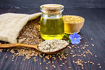 Image showing Flour linen in spoon with oil and seeds on board