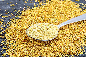 Image showing Mustard powder in spoon on board